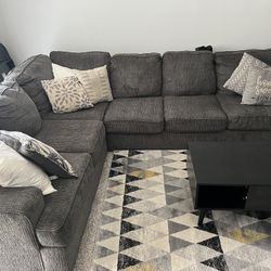 Sectional Couch, Rug,  and Table