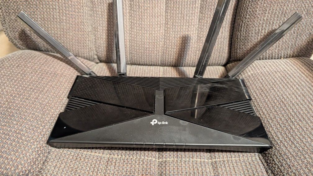 TP Link Router Has Multiple Steps For Corded In Wire Lines Also Has Wi-Fi Because Wi-Fi 6 And 5 Capabilities Speed Is Volume 1800 Gigs