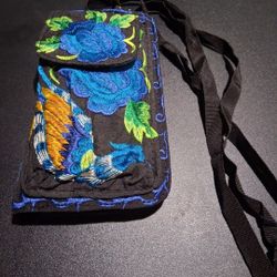 Beautiful new handmade wallet/purse with compartments for your cell phone and money. It has a removable strap