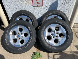 4) Jeep Wrangler Wheels and Tires   Size 255/70/18  Lug pattern 5x5  DOT 3417  Lug nuts included  $150 for 4
