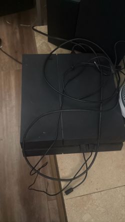 PS4 console and two controllers