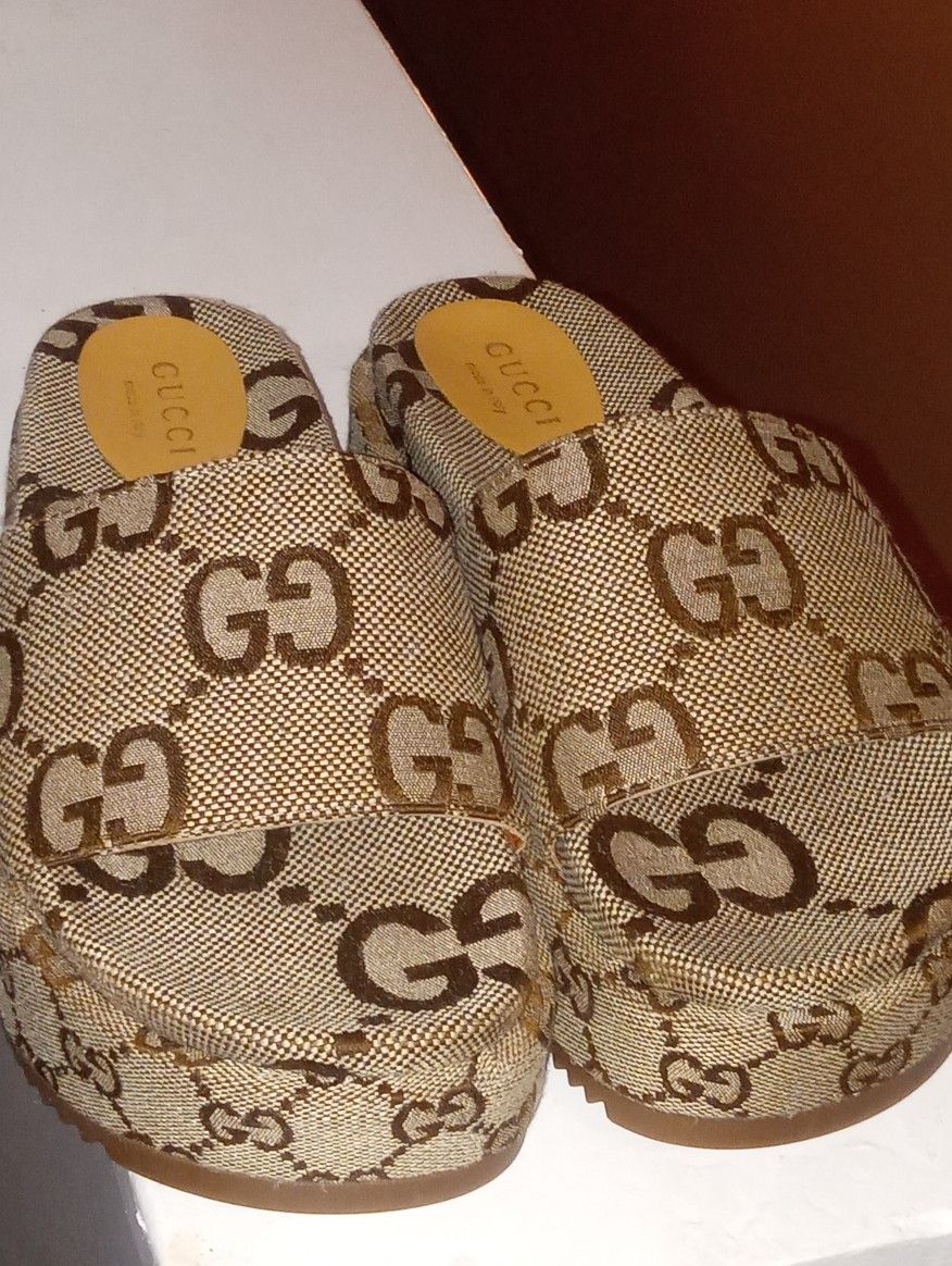 Gucci Sandals, Louis Vuitton Wallet, Versace Sunglasses.