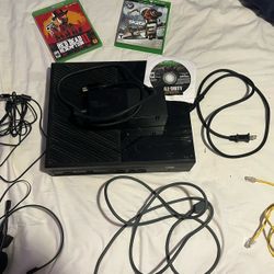 Original Xbox One w/ all necessary chords, two controllers + headset , ethernet cable, & misc games