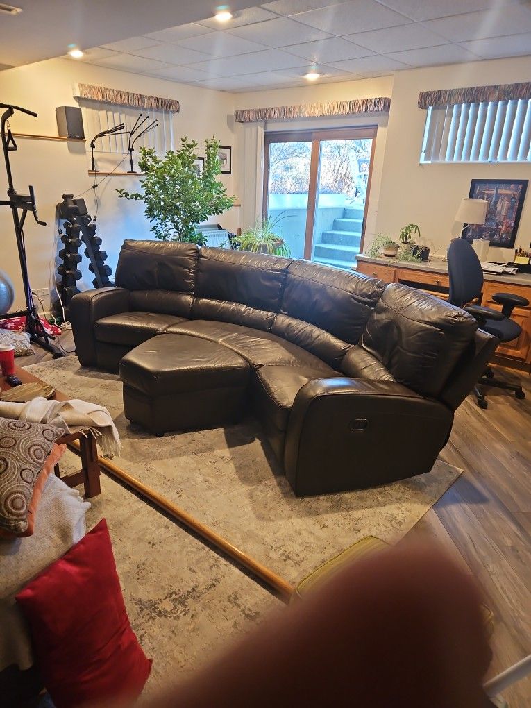 Curved leather sofa recliner