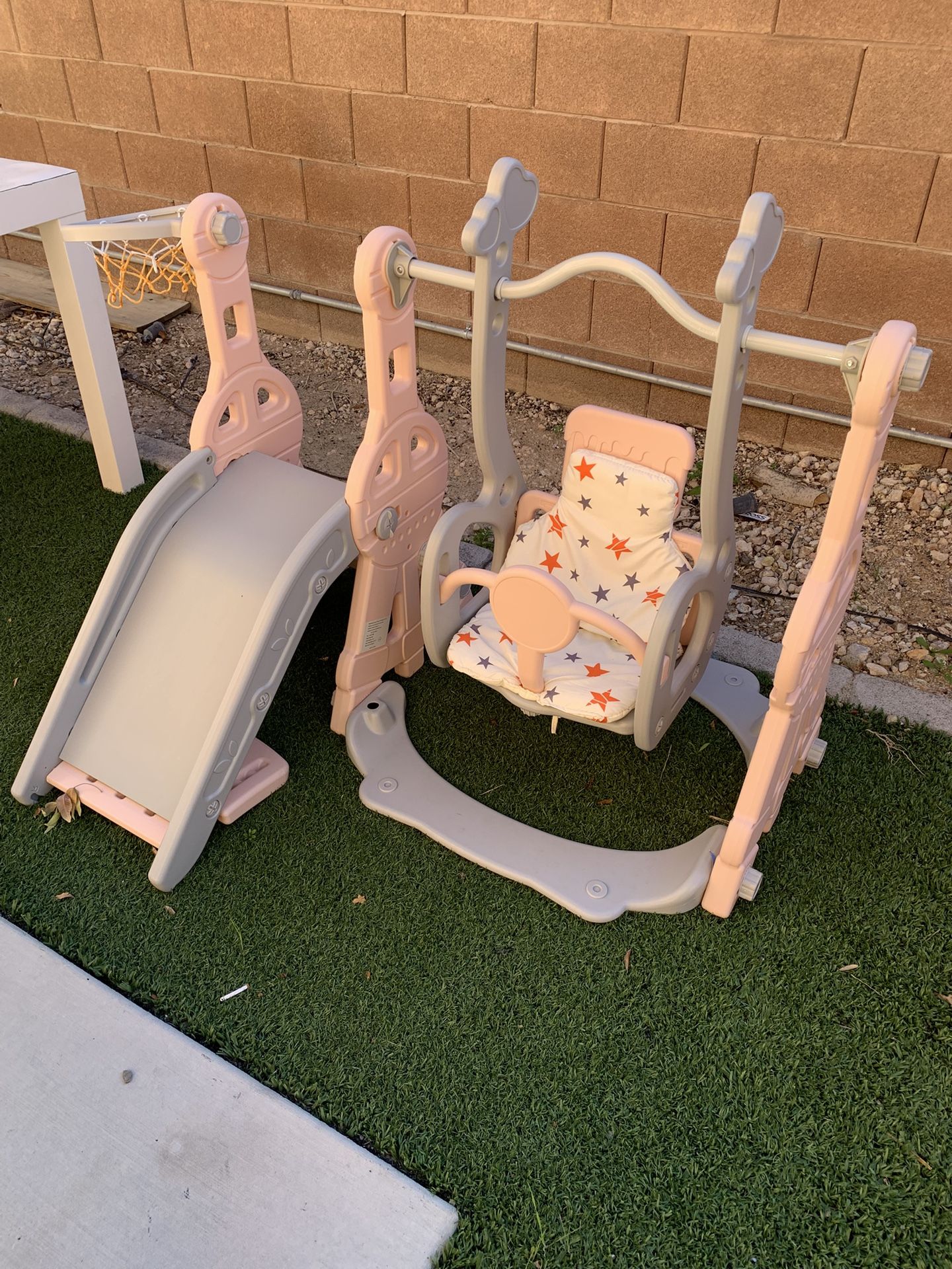 Toddler swing set with a basketball court
