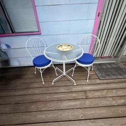 Wrought iron bistro set with two matching chairs with cushions Brad iron bistro set with two matching chairs with cushions