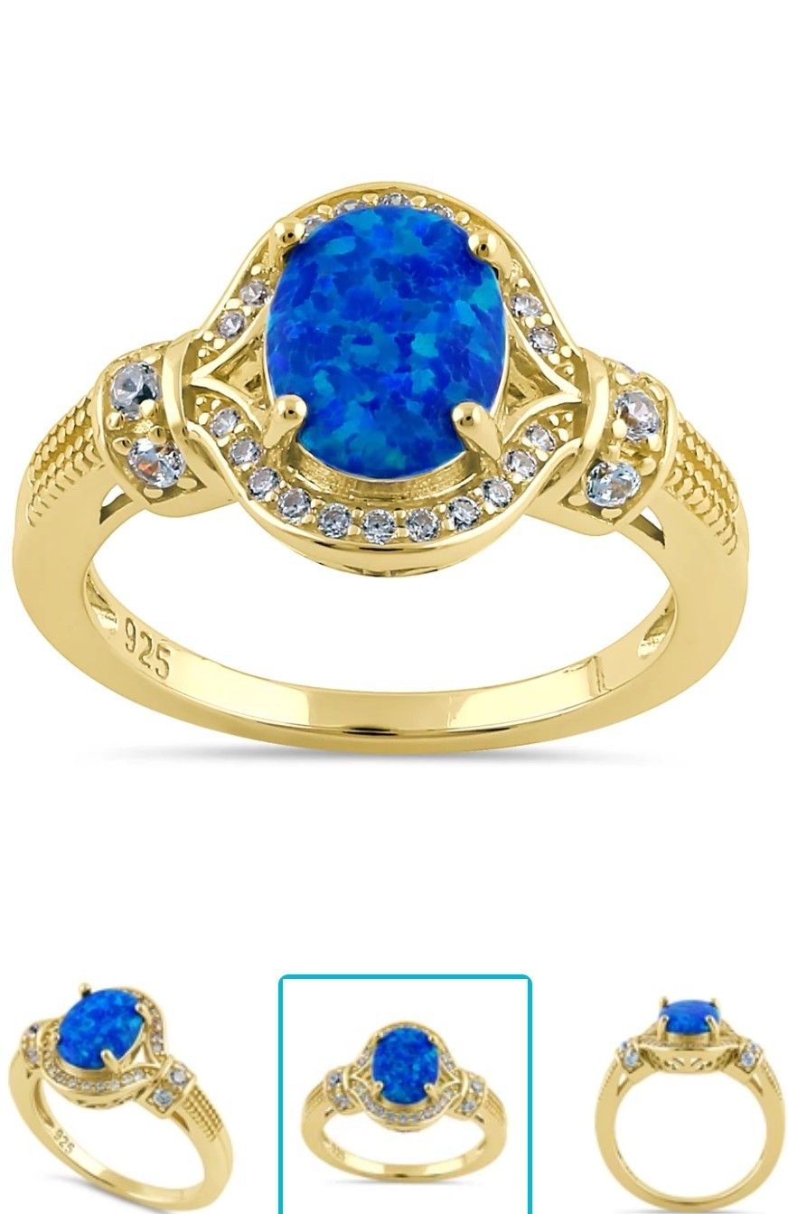 

Gold Stone Shape: Oval Blue Opal Ring Sz 5-11 Available 