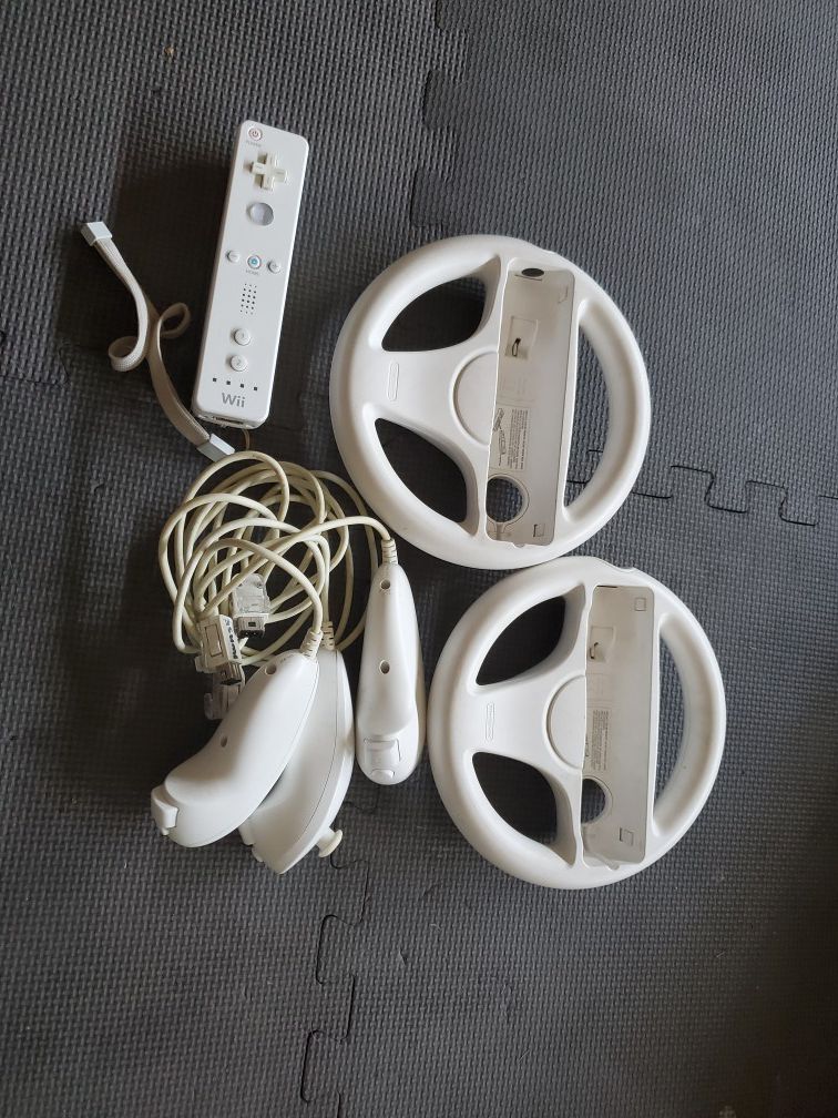 Wii controller, 2 steering wheels and 3 joy sticks
