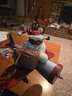 Antique hanging santa claus on a plane