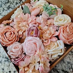 a box of Artificial Pink flowers and Vintage Roses for Party Centerpieces or Home Decor, Baby Shower or Birthday Flower Arrangements