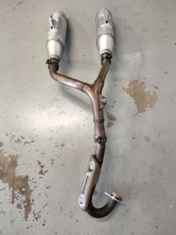 Twin Pipe Stock Exhaust System for a 2006 to 2009 Honda CRF250R.