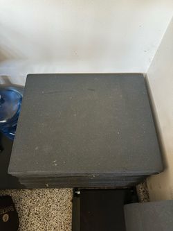 Grey 2 inch thick by 6 1/2 X 2 1/2 inch weightlifting rubber til