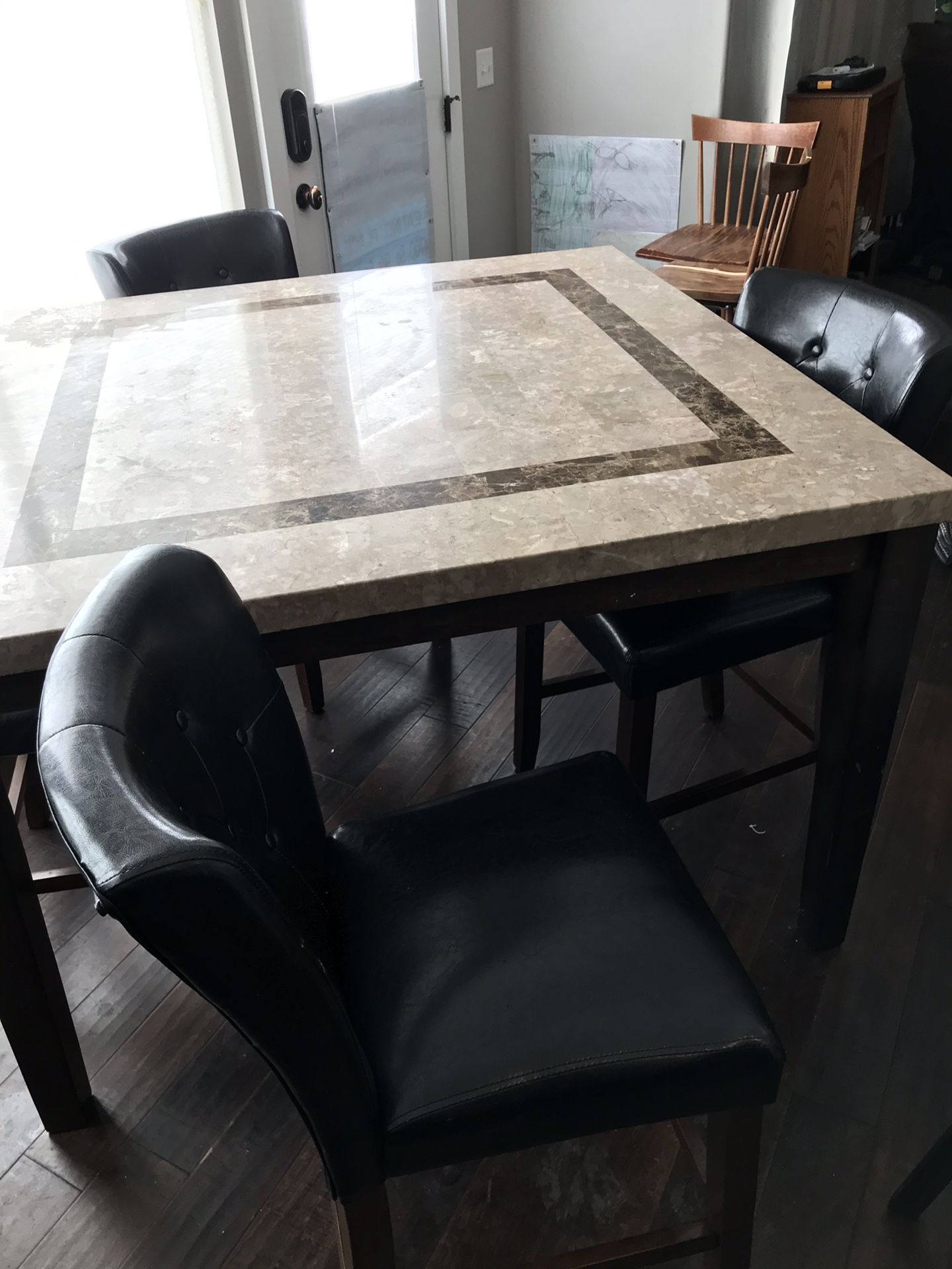 Marbled kitchen table and 4 Leather chairs.