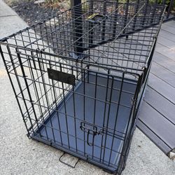Medium 30x22x19” Dog Crate with Tray in great shape!  Collapses easily for storage or transport!  