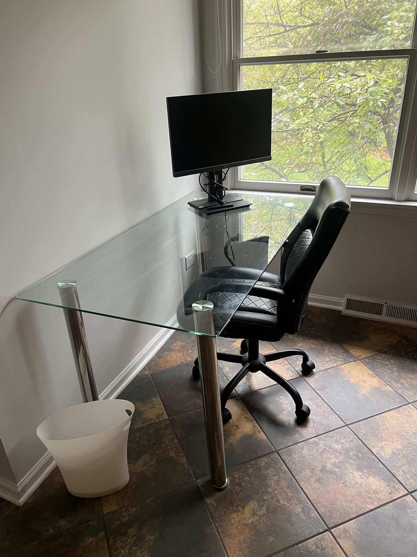 Glass desk with a chair