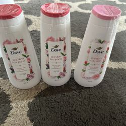 three bottles of Dove Garden Tea Party Nourishing Body Wash, specifically in the limited edition