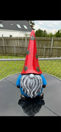 The red white blue and green gnome statue
