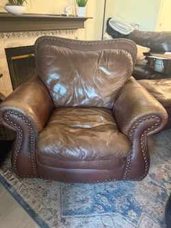 Brown leather love seat couch