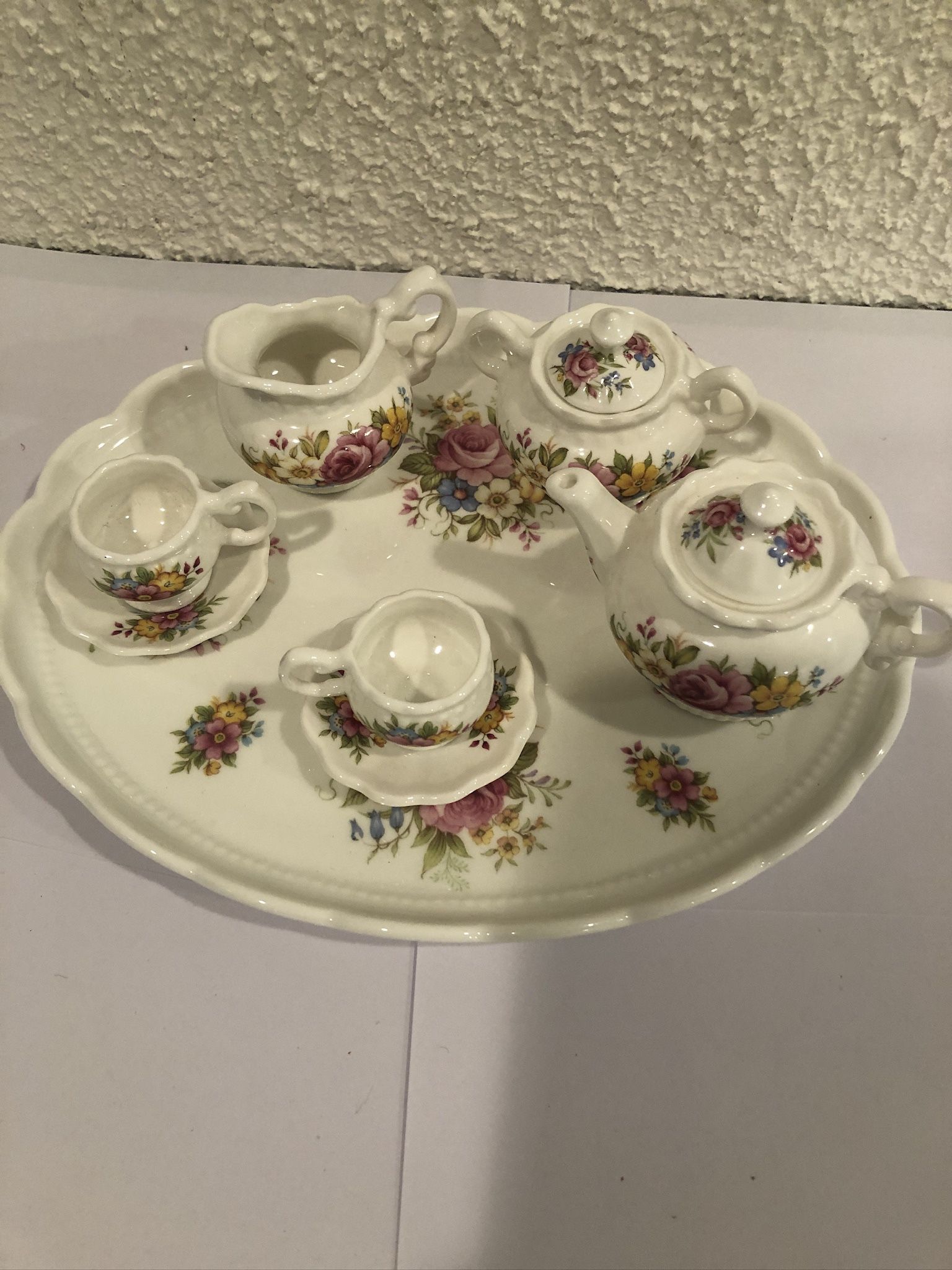 A Rare Miniature Bone China Tea Set by Connoisseur, Made In England , Tray Size Is 9”” The set includes a tray , creamer, tea pot , sugar bowl and t
