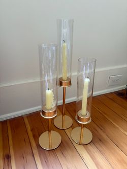 Set of 3 Tall Dinner Candle Holders with gold color finish and glass sleeves