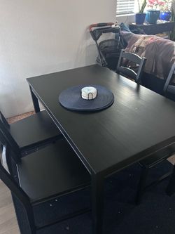 Small dining table and four dining chairs