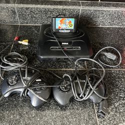 Sega genesis system with two controllers and one game Sonic to hedgehog tested works
