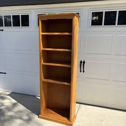 tall natural wood-finished bookcase