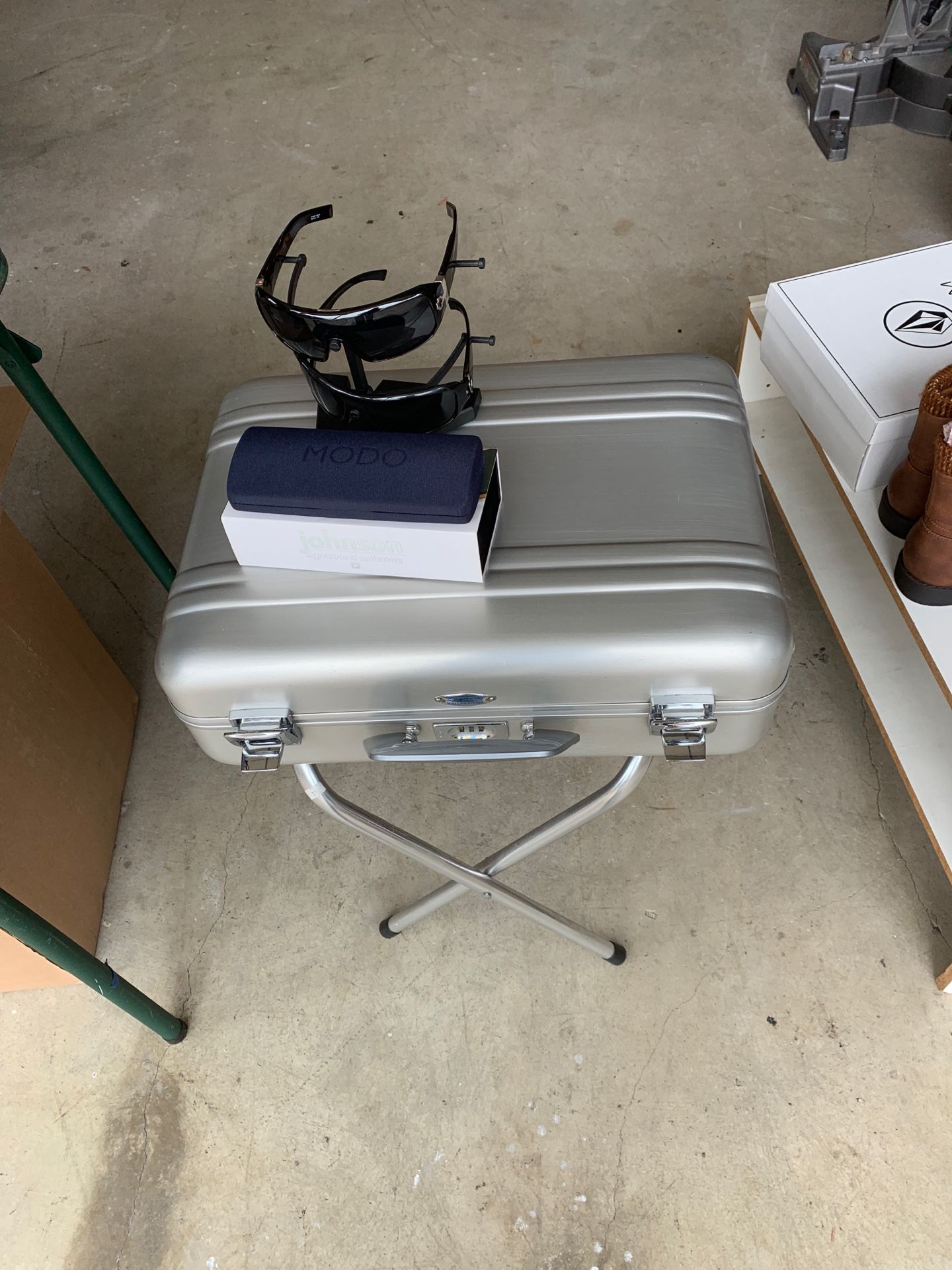 Auburn briefcase Von zipper and Oakley glasses and Johnson I am Moto