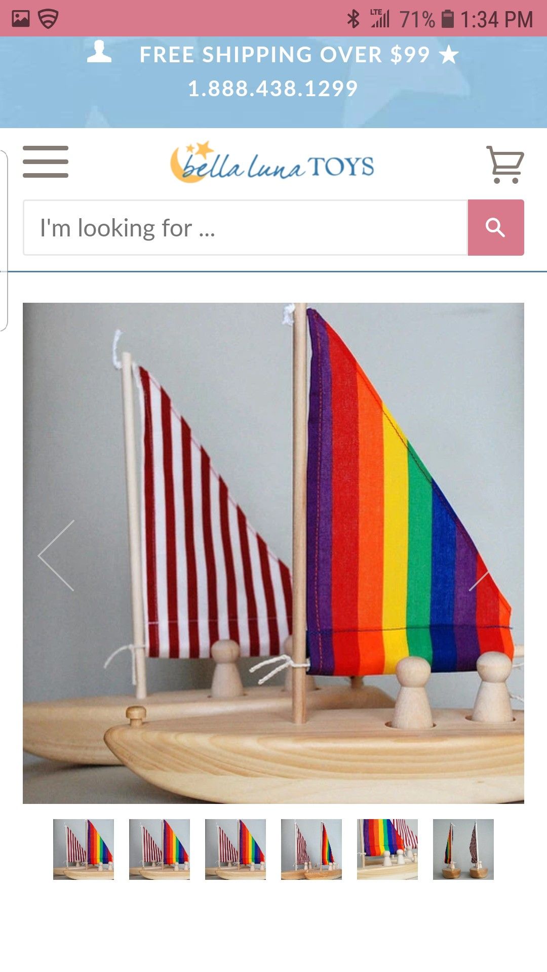 Rainbow wooden sailboat