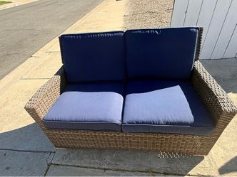 Outdoor Love Seat with Blue Cushions