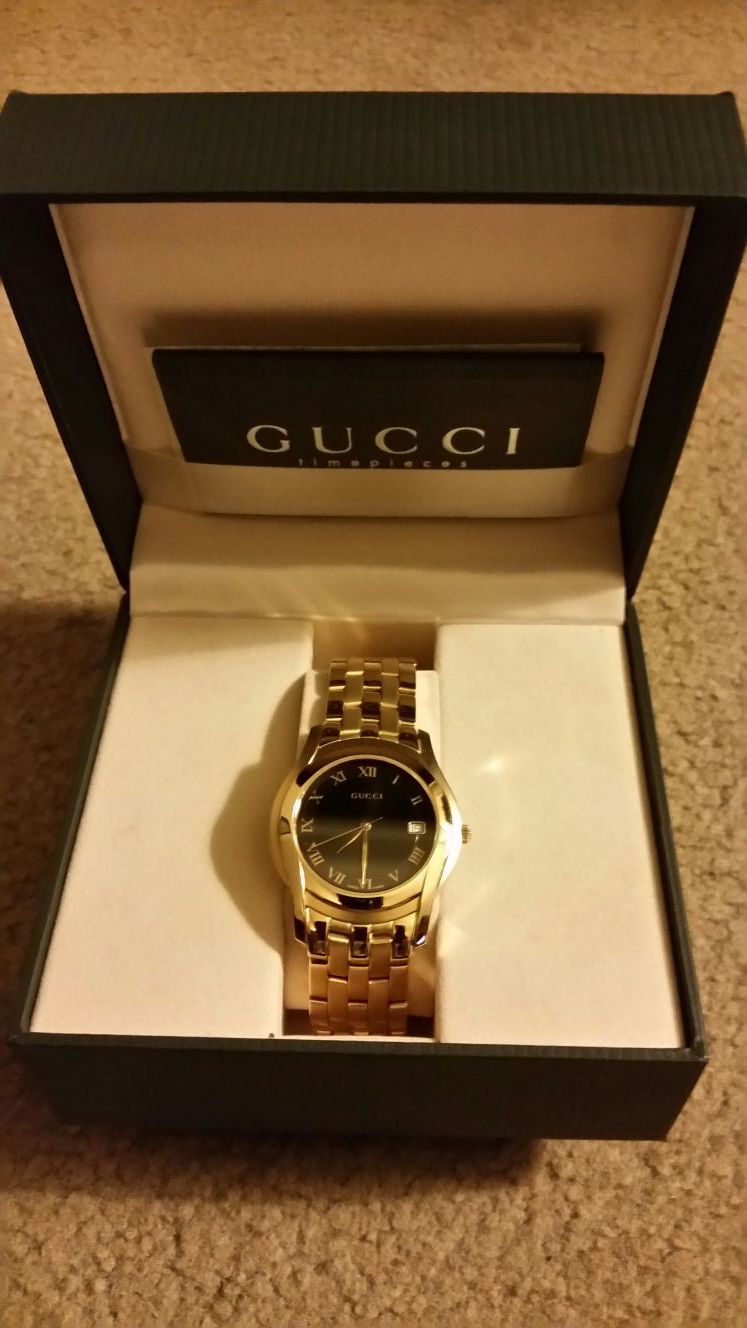 Brand new 18 karat gold plated Gucci watch