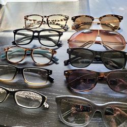 Various Sunglasses And Readers Glasses