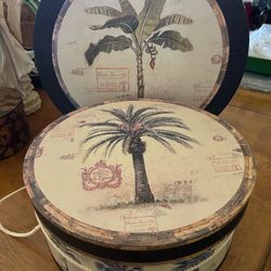 2 Nesting Decorative Round Boxes With Lids. Like New. 13.5 and 16 inches. One is 13.5 and one 16 inches.