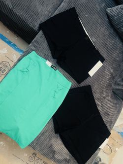 2 pair of Women’s black new shorts and 1 green skirt 
