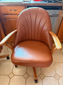 Brown Leather Swivel Chair with Wood Arms