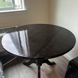 Cute brown circle table with foldable Leaf