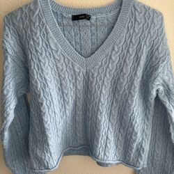 Shiny cable-knit V-neck sweater