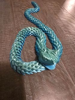 Articulating snake with movable jaw