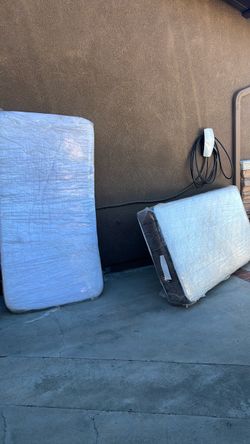 Two twin mattresses in perfect condition.  Not used only in guest room.  Wrapped in plastic.