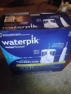 . Waterpik Ultra Plus + Cordless Enhance 3000 combo