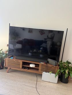 Tv and Soundbar with bass and surround sound