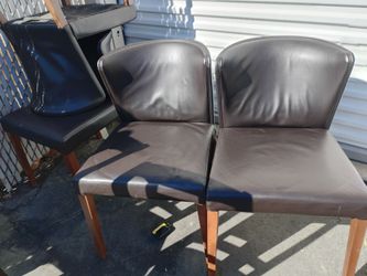 4 low back leather chairs and3 bar type chairs