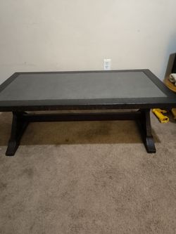 Vintage 48-in oak coffee table with blue stone/slate insert on top.