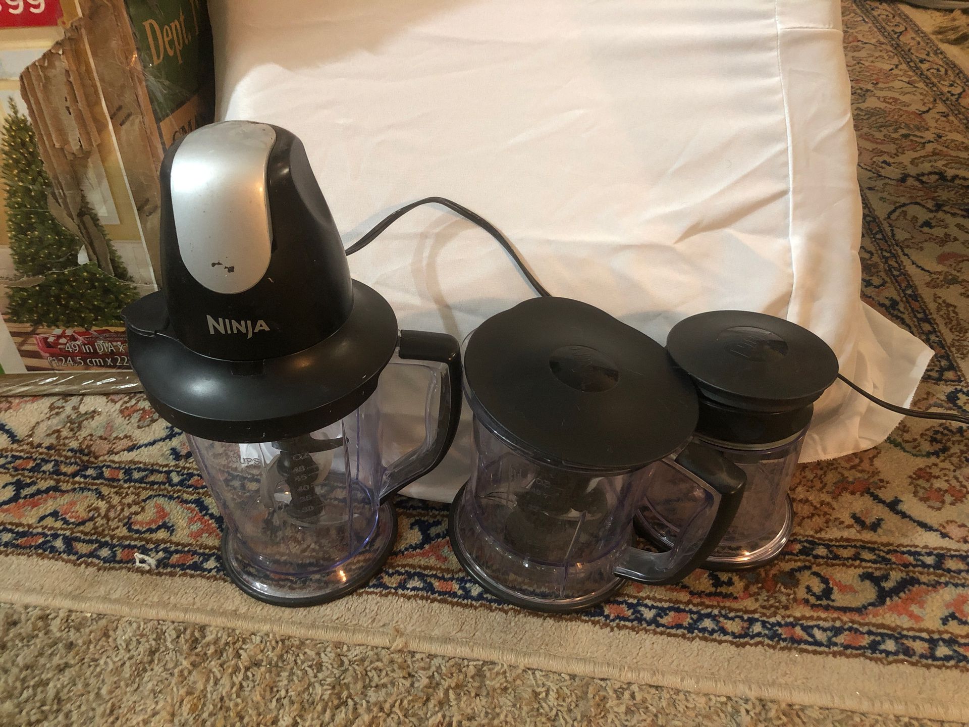 Ninja top blender with multiple blades, pitchers, and container