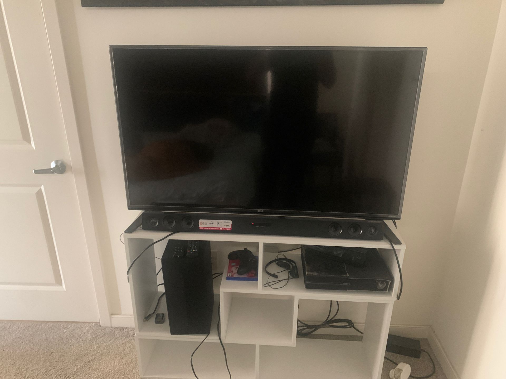 LG 55’ inches with LG sound bar and wireless subwoofer