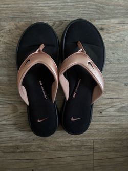 Nike Women's Black Flip Flops with Metallic Rose Straps