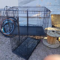 TWO ALMOST NEW DOG CAGES