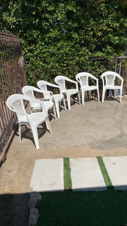 Six outdoor white chairs clean great condition comfortable they stuck each other easy to storage ready for summer