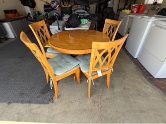 round wooden table with glass top 4 chairs included