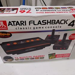 ATARI FLASHBACK 4  Classic game controller.   Good Condition.   76 built in games.  includes 2 wireless controllers. 